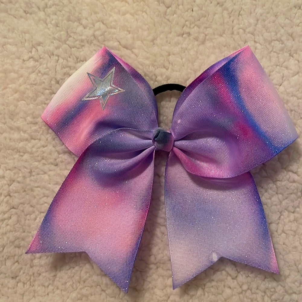 Handmade white bow dyed and a Star and glitter added.